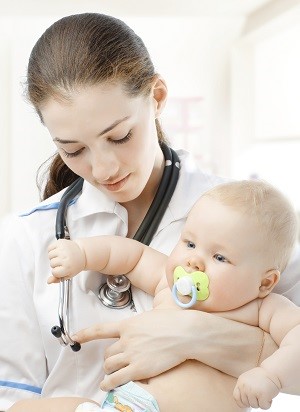 Doctor with baby at medical centre